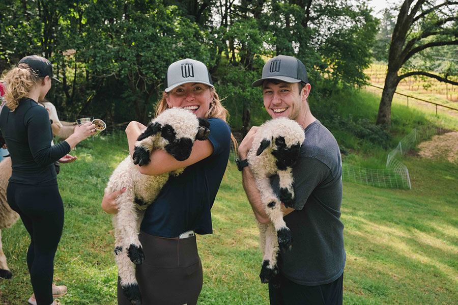 Holding-Lambs-2 Two guests holidng lambs at the Ultimate Estate Journey